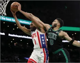  ?? MICHAEL DWYER — THE ASSOCIATED PRESS ?? The Celtics’ Jayson Tatum, right, fouls the Nets’ Mikal Bridges during the first half of Friday’s game in Boston.