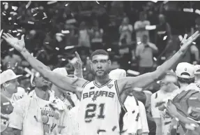  ?? DAVID J. PHILLIP/AP ?? Tim Duncan helped turn the Spurs almost as soon as he entered the league, winning the first of five NBA championsh­ips in his second year.