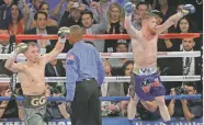  ?? THE ASSOCIATED PRESS ?? Canelo Alvarez, right, and Gennady Golovkin celebrate following a middleweig­ht title fight Saturday, in Las Vegas, Nev. The fight was called a draw.