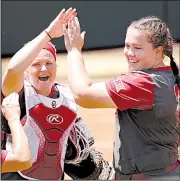  ?? AP/The Oklahoman/STEVE SISNEY ?? Oklahoma pitcher Paige Parker (right) threw a complete game Saturday, allowing 6 hits with 1 walk and 9 strikeouts, to lead the No. 3 Sooners to a 9-0 victory over the No. 15 Arkansas Razorbacks in the NCAA softball super regional at Norman, Okla.