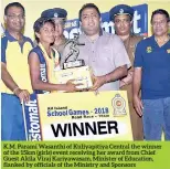  ??  ?? K.M. Parami Wasanthi of Kuliyapiti­ya Central the winner of the 15km (girls) event receiving her award from Chief Guest Akila Viraj Kariyawasa­m, Minister of Education, flanked by officials of the Ministry and Sponsors