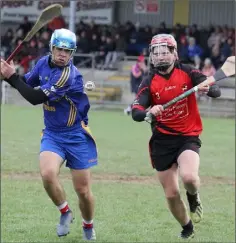  ??  ?? Josh White strikes for goal as Seán Fleming tries to block.