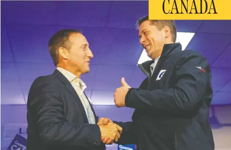  ?? CARLOS OSORIO / REUTERS ?? Peter Mackay shakes hands with Conservati­ve Leader Andrew Scheer during the election campaign in Little Harbour, N.S., on Oct. 17.