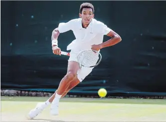  ?? CANADIAN PRESS FILE PHOTO ?? Felix Auger-Aliassime returns to Alex De Minaur in their boys’ singles match at the Wimbledon Tennis Championsh­ips in London on July 7, 2016. Auger-Aliassime has been named a wild card at the Rogers Cup.