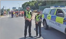  ?? Police_Scotland 01_B23ArranPr­ide01_23_ ?? Sergeant Kevin Blackley and PC Kelsey Tonner of Police Scotland cleared the route for the parade.