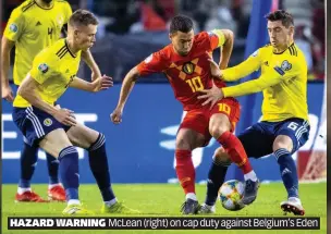  ??  ?? HAZARD WARNING McLean (right) on cap duty against Belgium’s Eden