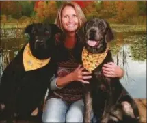  ?? PHOTO PROVIDED ?? Marshall County Humane Society Director Nancy Cox with her two rescues Trapper and Sissy.