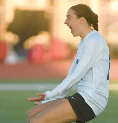  ?? STEVE JOHNSTON/DAILY SOUTHTOWN ?? Lincoln-Way East’s Mia Hedrick exults after defeating Lincoln-Way Central in penalty kicks during the Windy City Ram Classic semifinals at Reavis in Burbank on Tuesday.