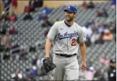  ?? CRAIG LASSIG — THE ASSOCIATED PRESS ?? Dodgers pitcher Clayton Kershaw heads back to the dugout after getting the final out of the seventh inning against the Minnesota Twins on Wednesday.