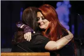  ?? WADE PAYNE — INVISION/AP ?? Wynonna Judd, right, hugs sister Ashley Judd during the Medallion Ceremony at the Country Music Hall of Fame in Nashville on Sunday.