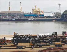  ??  ?? Steel rims being loaded onto trucks at Mumbai Port Trust.