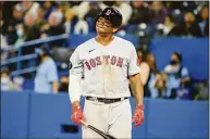  ?? Christophe­r Katsarov / Associated Press ?? The Red Sox's Rafael Devers gestures after taking a strike during the ninth inning against the Blue Jays on Thursday.