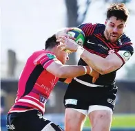  ??  ?? Half held: Saracens’ Sean Maitland is tackled by Pirates’ Rory Parata on the way to scoring