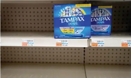  ?? ?? Two boxes of Tampax Pearl tampons are seen on a shelf at a store in Washington DC on 14 June. Photograph: Stefani Reynolds/AFP/Getty Images