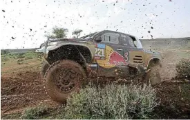  ?? /Reuters ?? Muddy rides: Guillaume de Mevius and co-driver Xavier Panseri on their way to a stage one victory during the Dakar Rally.