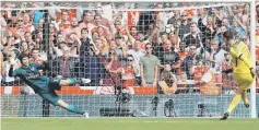  ??  ?? Chelsea’s Thibaut Courtois misses a penalty during the penalty shootout. — Reuters photo