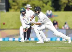  ?? — AFP ?? CHRISTCHUR­CH: New Zealand’s Jeet Raval (R) bats watched by Pakistan’s Azhar Ali (L) during day two of the first cricket Test match between New Zealand and Pakistan at the Hagley Park in Christchur­ch yesterday.