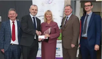  ??  ?? Anne Tracey accepts a cheque from Cathedral Financial Consultant­s at the opening of the new pop up charity shop for the Gary Kelly Cancer Support Centre. Presenting to Anne are John Gallagher, Barry Oliver, Larry Murphy and Paddy Keenan. Below: Paul...