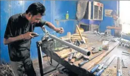  ??  ?? A worker making a gun at a factory in Jammu. The Indian government banned civilian firearms licenses in early 1990s in Kashmir valley when an armed rebellion broke out against Indian rule. NITIN KANOTRA/HT