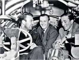  ??  ?? Benson, right, in a midget submarine at Pinewood studios with CET Warren, centre, with whom he wrote Above Us the Waves, and Donald Sinden, who plays a submarine officer in the film version