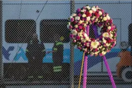  ?? KARL MONDON — BAY AREA NEWS GROUP ?? A wreath rests at a vigil ceremony commemorat­ing the one-year anniversar­y of the VTA shooting at the transit agency’s Guadalupe Yard on Thursday in San Jose.