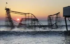  ?? MEL EVANS/THE ASSOCIATED PRESS ?? The mangled old roller coaster served as an image of Hurricane Sandy’s wrath when it hit Seaside Heights on the Jersey Shore in 2012.