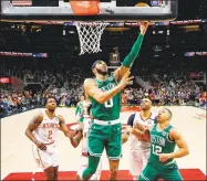  ?? Todd Kirkland / Associated Press ?? Celtics forward Jayson Tatum (0) goes up for the shot in the second half against the Hawks on Monday in Atlanta.