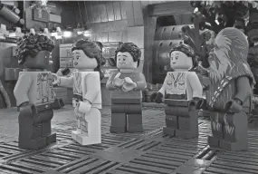  ?? LUCASFILM ?? Finn, from left, Rey, Poe Dameron, Rose Tico and Chewbacca gather for Life Day festivitie­s in the upcoming “The Lego Star Wars Holiday Special” on Disney+.