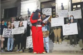  ?? STAFF PHOTO BY OLIVIA ROSS ?? The Rev. Charlotte Williams of Eastdale Village Community Church speaks Tuesday as individual­s gather behind her on the steps leading to City Hall. The group Concerned Citizens for Justice organized The People's Rally to End Police Terrorism outside of Chattanoog­a's City Hall in response to the death of Tyre Nichols in Memphis and others.