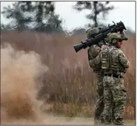  ?? ?? U.S. Special Operations Service members train with shoulder-fired rocket launchers at a remote range in Fort Chaffee on Oct. 23. (The New York Times/Kenny Holston)