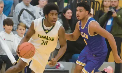  ?? AMY SHORTELL/MORNING CALL PHOTOS ?? Emmaus’ Jametric Harris drives down the court. Emmaus plays Allen High in both team’s boys basketball Eastern Pennsylvan­ia Conference opener Tuesday at Emmaus.