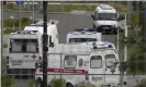  ?? Photograph: Alexander Zemlianich­enko/AP ?? Ambulances wait to deliver patients suspected of having coronaviru­s to a hospital in Kommunarka, outside Moscow.