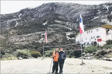  ??  ?? Karen and Desmond at Laban Rata with Mount Kinabalu in the background.