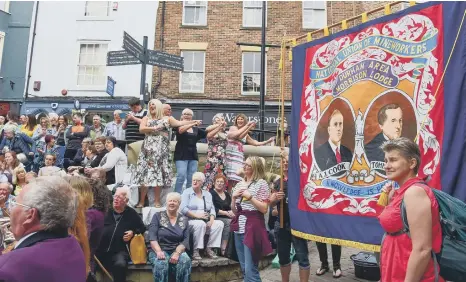  ?? ?? Crowds watch the lodge banners at Durham Miners’ Gala.