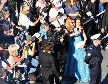  ??  ?? Chinese-Malaysian actress Michelle Yeoh poses for selfies at the 70th edition of the Cannes Film Festival in Cannes. (AFP)