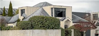  ?? PETER MEECHAM/STUFF ?? At left, part of the defective eight-storey building at 230 High St engineered by Joo Cho which has been empty for four years, and, above, his house in Staveley St, Avonhead that was designed by him and is now in his wife’s name.