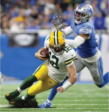  ?? MIKE MULHOLLAND/GETTY IMAGES ?? A victory against the Lions will get Aaron Rodgers and the Packers in the playoffs.