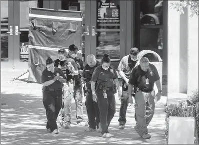  ?? AP/Austin American-Statesman/JAY JANNER ?? Officials investigat­e Monday after a fatal stabbing attack at the University of Texas campus in Austin.