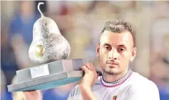  ??  ?? Australian tennis player Nick Kyrgios holds the trophy after defeating German tennis player Alexander Zverev during the Mexico ATP Open men’s singles tennis final in Acapulco, Guerrero state on March 2, 2019. - AFP photo
