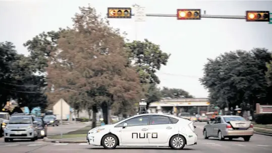  ?? Annie Mulligan / Contributo­r ?? A Nuro delivery vehicle completes training routes in Meyerland in southwest Houston.