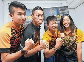  ??  ?? 自費參加亞運會鐵人三­項賽的4名大馬選手陳­凱紳（左起）、楊友用、鍾詩雲和張素玲，誓要在8月亞運會力爭­佳績。