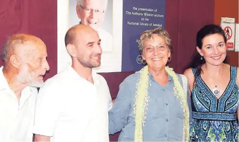  ?? PHOTO BY MICHAEL RECKORD ?? Poet and actor Roy Thomas (left) poses with members of the Winkler family: Adam, Cathy and Becky.