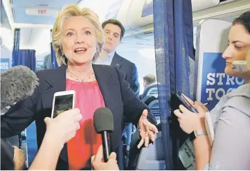  ??  ?? Clinton talks to reporters on her campaign plane in White Plains, New York, US. — Reuters photo