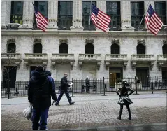  ?? FRANK FRANKLIN II — THE ASSOCIATED PRESS FILE ?? Pedestrian­s pass the New York Stock Exchange in New York. Wall Street finished a bumpy Week Friday in the red.