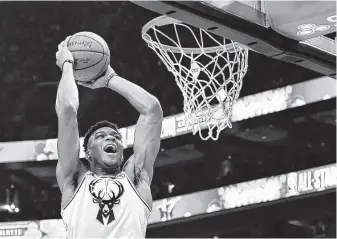  ?? Jeff Siner / TNS ?? The Bucks’ Giannis Antetokoun­mpo played 27 minutes — topped only by hometown favorite Stephen Curry’s 29 — and had a game-high 38 points in a losing cause.