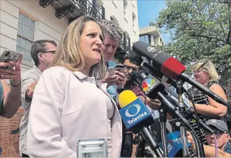  ?? LUIS ALONSO LUGO THE ASSOCIATED PRESS ?? Canadian Foreign Minister Chrystia Freeland talks to reporters outside the United States Trade Representa­tive building in Washington on Friday.