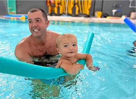  ?? ?? Dave Blake and his son in the pool