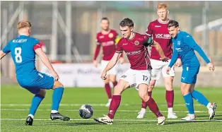  ?? ?? Stenhousem­uir’s Mikey Anderson (No. 17) attempts to go past Peterhead’s Andy Mccarthy.