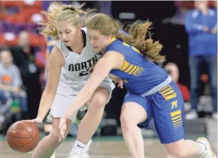  ?? MARK HOFFMAN / MILWAUKEE JOURNAL SENTINEL ?? Appleton North's Lilli VanHandel (left) and Mukwonago's Kat Lopez chase after a loose ball during the first half of their WIAA Division 1 championsh­ip game Saturday night.