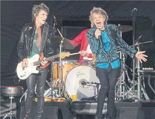  ?? RED THORNHILL THE CANADIAN PRESS ?? Ronnie Wood and Mick Jagger hit the stage Saturday at Burl’s Creek in Oro-Medonte for the only Canadian stop on their tour. See Monday’s Star for a concert review.